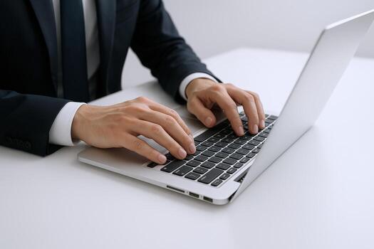 Businessman Typing on Laptop Keyboard for Professional Communication and Online Work Tasks in Office Environment photo