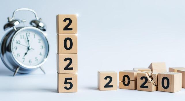Transition to 2025 Conceptual Image with Wooden Blocks and Clock Representing Future Goals and Opportunities photo