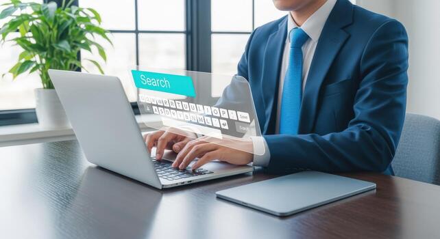 Businessman Typing on Laptop with Search Bar Interface Overlay for Online Information Access and Connectivity photo