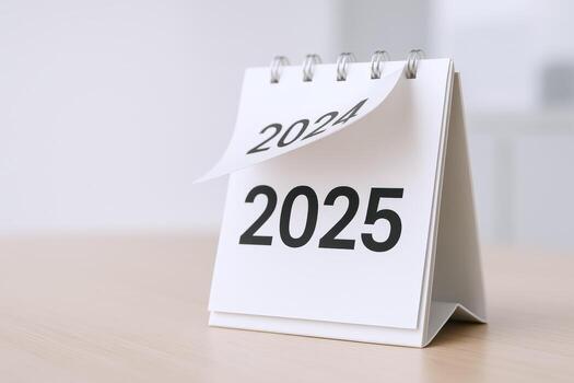 Calendar Flipping from 2024 to 2025 Symbolizing New Year, Planning, Goals, and Future Opportunities photo