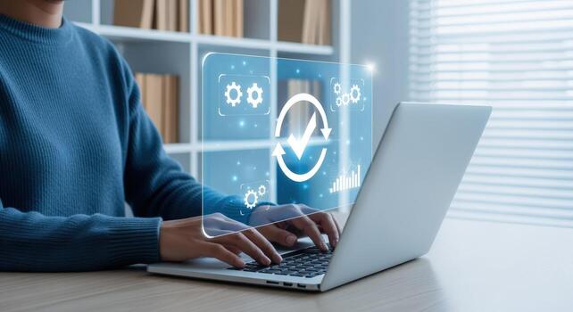 Woman using laptop for process automation, efficiency, and quality control in a modern workspace photo