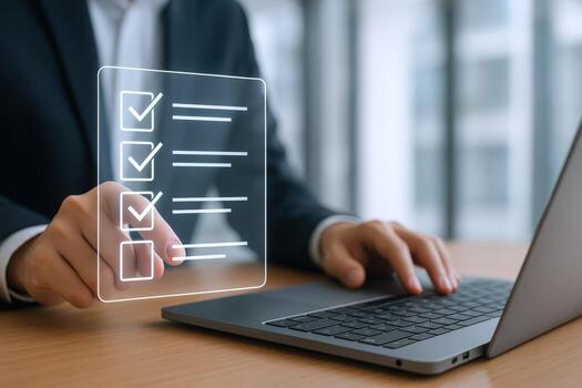 Businessman Interacting with Digital Checklist Interface on Laptop, Representing Task Management and Productivity photo
