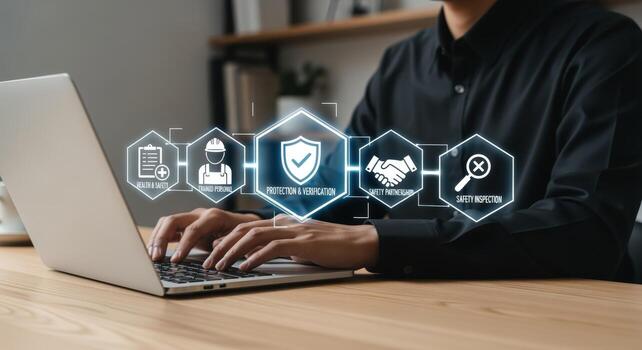 Man using laptop for safety regulation verification, showcasing quality control, compliance, and risk management procedures photo