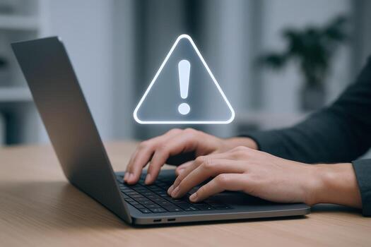 Laptop User Faces Online Security Threat Alert Symbol Displayed on Screen, Risk of Phishing and Malware photo