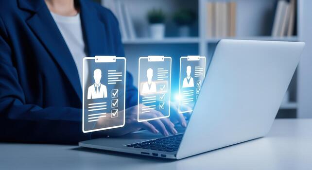 Human Resources Professional Reviewing Applications Online via Laptop for Recruitment and Employee Selection Process photo