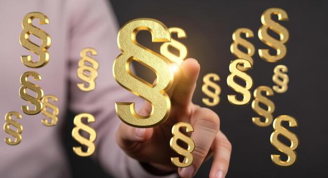 Law and Justice Concept Hand Pointing at Golden Paragraph Symbol Displayed in a Digital Interface photo