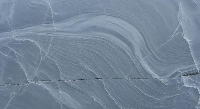 Abstract rock formation featuring light blue and gray textures, suitable for backgrounds and artistic designs photo