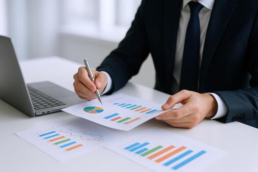 Business Professional Analyzing Financial Charts and Graphs in Office Setting for Data-Driven Decision-Making photo