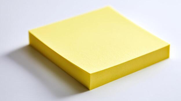 Stack of Yellow Sticky Notes on White Surface, Conceptual for Reminders, Office, and Organization photo