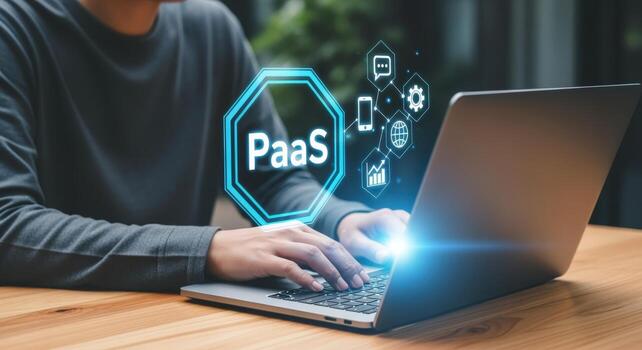 PaaS Technology Concept Man Typing on Laptop with Platform as a Service Visualization photo