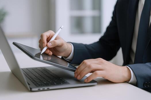 Professional Man Working with Laptop and Tablet, Digitally Signing Documents for Business Efficiency photo