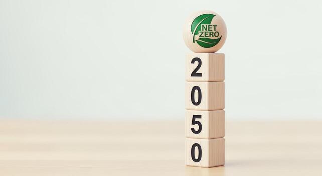 Net Zero 2050 Target Concept Wooden Blocks Stacked with Environmental Symbolism for Sustainable Future Initiatives photo