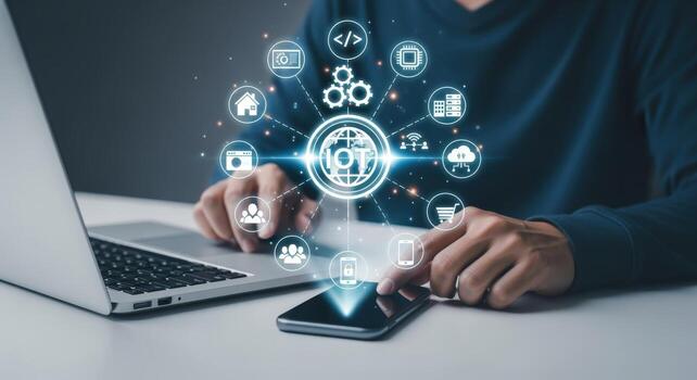 Internet of Things Concept Person Interacting with Virtual IoT Icons on a Mobile Phone and Laptop photo