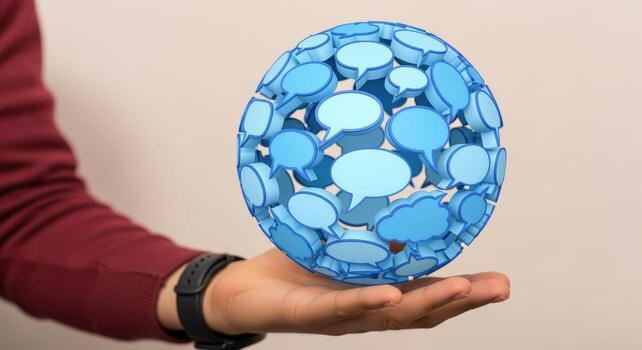 Communication Sphere Hand Holding a Globe of Speech Bubbles, Conceptual Image for Connection and Dialogue photo