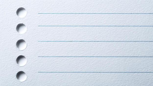 Lined Paper Close-Up with Perforated Edge A Blank Canvas for Notes and Ideas photo
