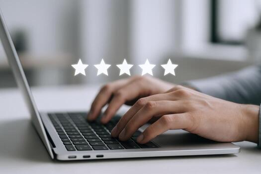 Customer Experience Person Typing on Laptop with Five Star Rating Overlay for Feedback and Satisfaction photo