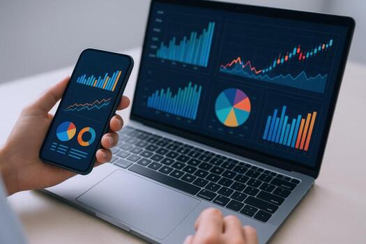 Data Analytics on Mobile and Laptop Screen Displaying Charts and Graphs for Business Strategy photo