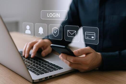 Secure Online Access Man Using Laptop and Phone to Login to a Digital Account photo