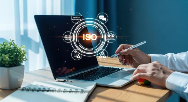 ISO Standards Implementation Concept Man Working on Laptop Displaying Quality Management System Graphic photo