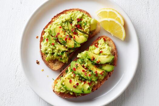 Avocado Toast on Plate with Lemon Slices, Healthy Breakfast Concept, Top View photo