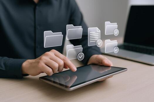 Man uses digital tablet to manage documents and files for business efficiency and organization photo