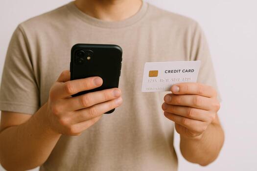Man Holding Credit Card and Using Smartphone for Online Payment, E-commerce and Modern Banking photo