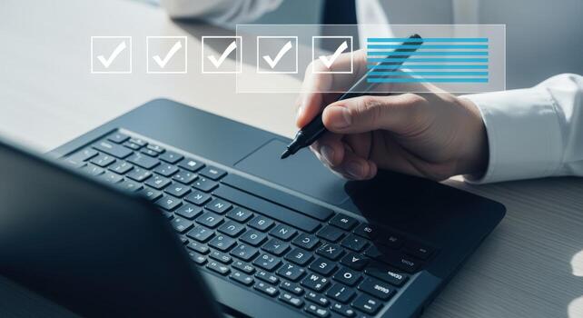 Online Survey Completion on Laptop with Pen, Checkmarks, and Progress Bar for Digital Feedback photo