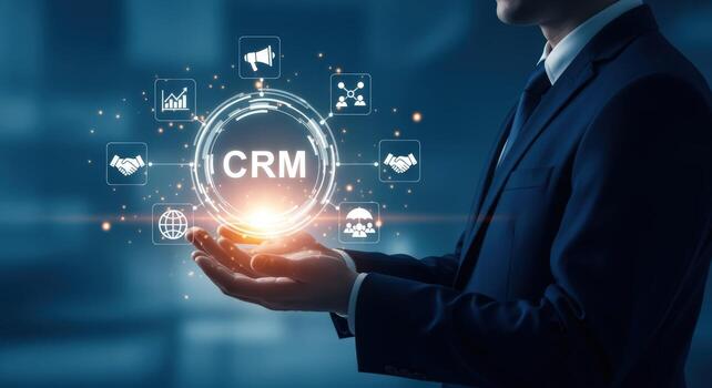 Customer Relationship Management CRM concept Businessman holding a digital interface representing connection between business and clients photo