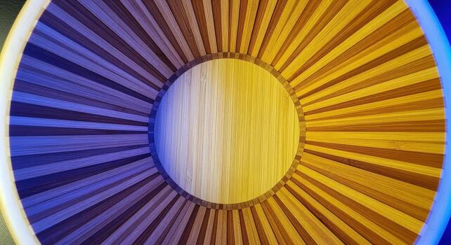 Abstract Circular Wooden Pattern with Yellow and Blue Lighting for Creative Backgrounds and Designs photo