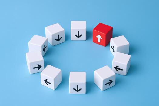 Conceptual Leadership A Red Cube Stands Out Among White Cubes with Arrows in a Circular Formation photo