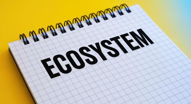 Ecosystem Concept on Notepad Interconnected System Diagram for Sustainability and Balance on Bright Yellow Background photo
