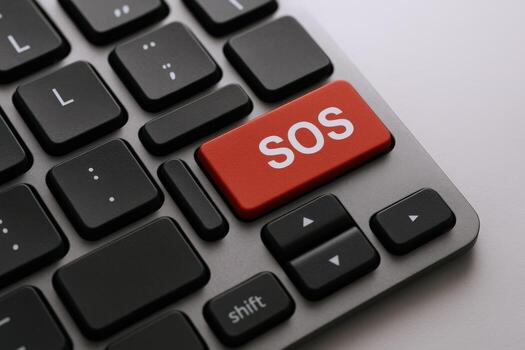 Emergency SOS Button on Keyboard Close-up Urgent Help, Support, and Assistance Needed Online photo