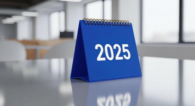 Blue Desk Calendar Mockup Displaying 2025 Year in Modern Office Setting for Business Planning photo