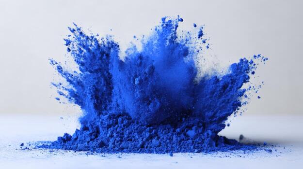 Vibrant Blue Powder Explosion Dynamic Pigment Burst for Creative Projects and Artistic Visuals photo