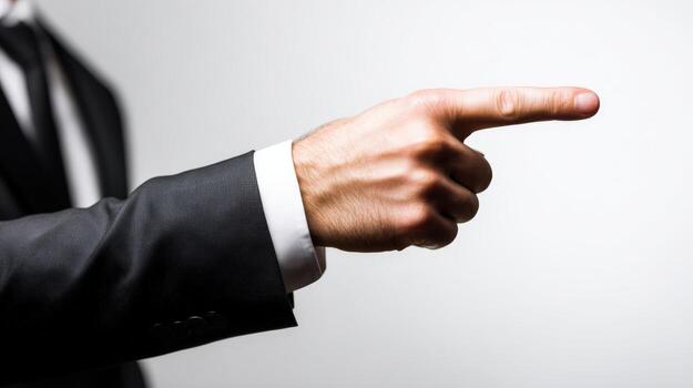 Pointing finger of a businessman, focus on the hand, isolated on white background representing choice or direction photo