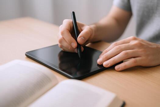Digital Artist Working on Tablet with Pen, Creative Designer at Desk, Close-up View photo