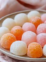 Sweet Colorful Mochi Balls Delight on a Plate, A Perfect Dessert Treat. photo