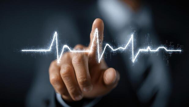 A man in a suit is pointing at a heartbeat line photo