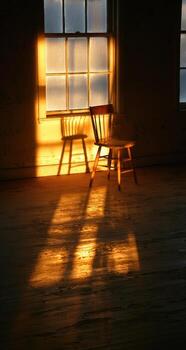 A chair and a window in a room photo