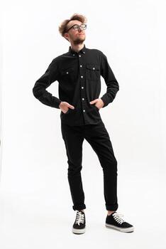 Software developer posing with hands in pockets on white background photo