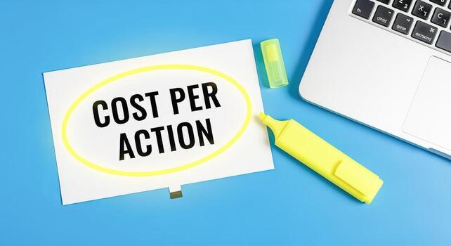 Cost Per Action Concept Displayed with Yellow Marker and Laptop on Blue Background for Marketing photo