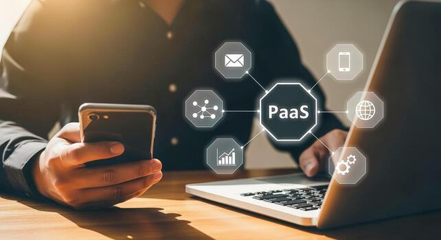 Man using laptop with platform as a service PaaS concept illustrated by floating icons photo