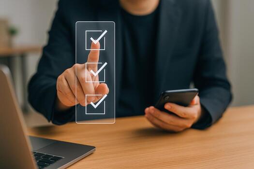 Man Interacting with a Digital Checklist on Screen, Holding a Smartphone, Task Management photo