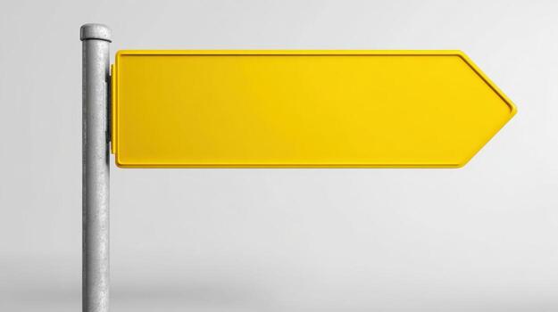 Blank Yellow Directional Sign on Metal Pole Against White Background Offering Space for Customization photo