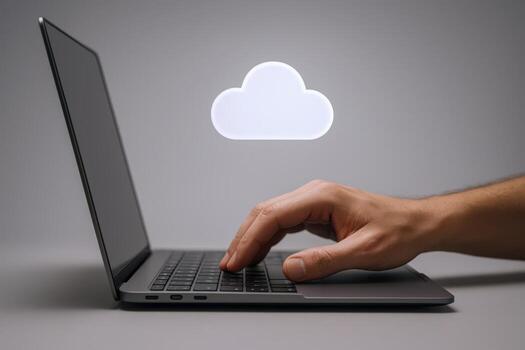 Cloud Computing Concept Hand Typing on Laptop with Cloud Icon for Data Storage photo