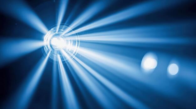 Futuristic Blue Light Rays Bursting from a Central Point in Dark Background Creating Dynamic Effect photo