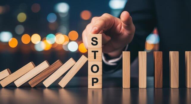Stopping Domino Effect with Wooden Blocks Risk Management, Intervention, and Strategic Prevention Concept photo