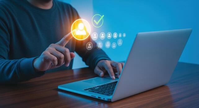 Human resources and talent acquisition specialist reviews online applicant profiles with holographic technology and virtual interface photo