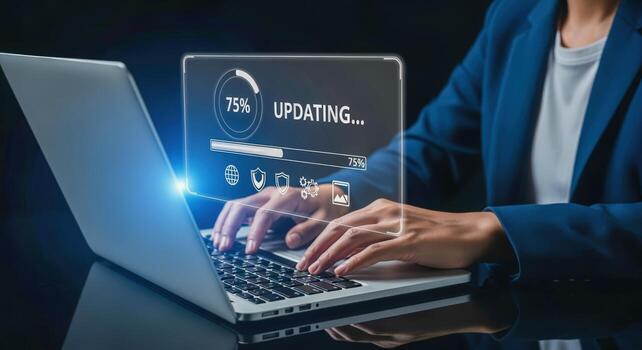 Software Upgrade in Progress Displayed Over Laptop with Person Typing, Showing System Update Installation photo