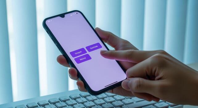 Person Using Mobile Phone with App Interface Against Window Blinds for Business or Communication photo